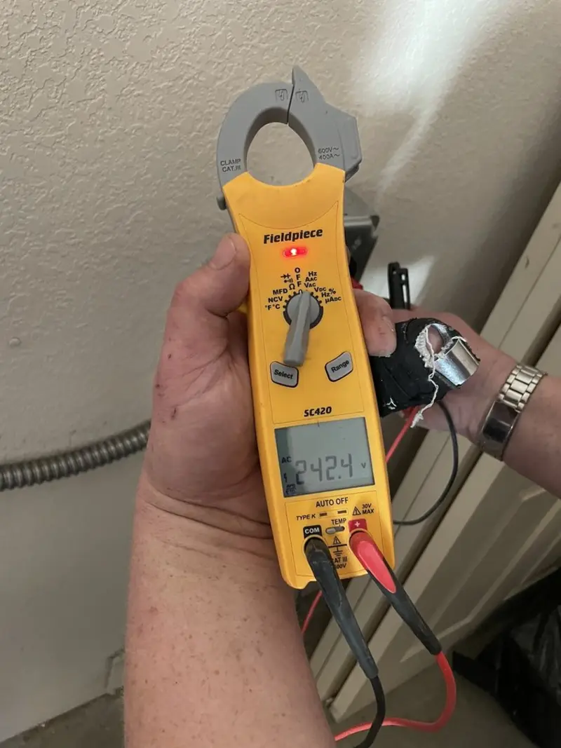 Voltage testing with clamp meter during Whole House Surge Protector in Upper Paxton